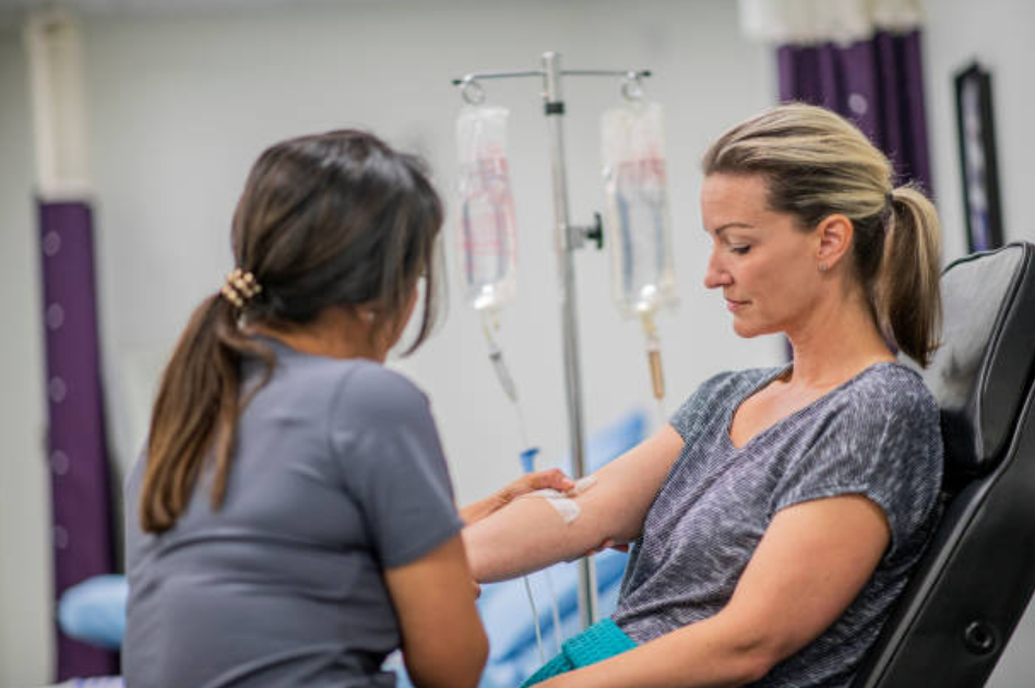 A woman receives NAD injections to support her wellness and energy levels.