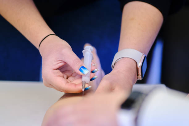 A provider injects a patient with NAD injections for enhanced energy and cellular health.